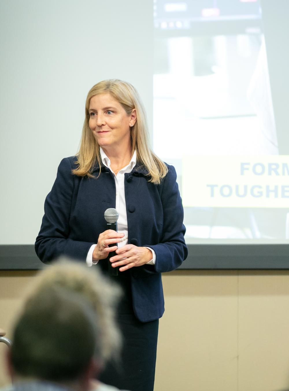 Beth Meinert speaking at an all-employee meeting
