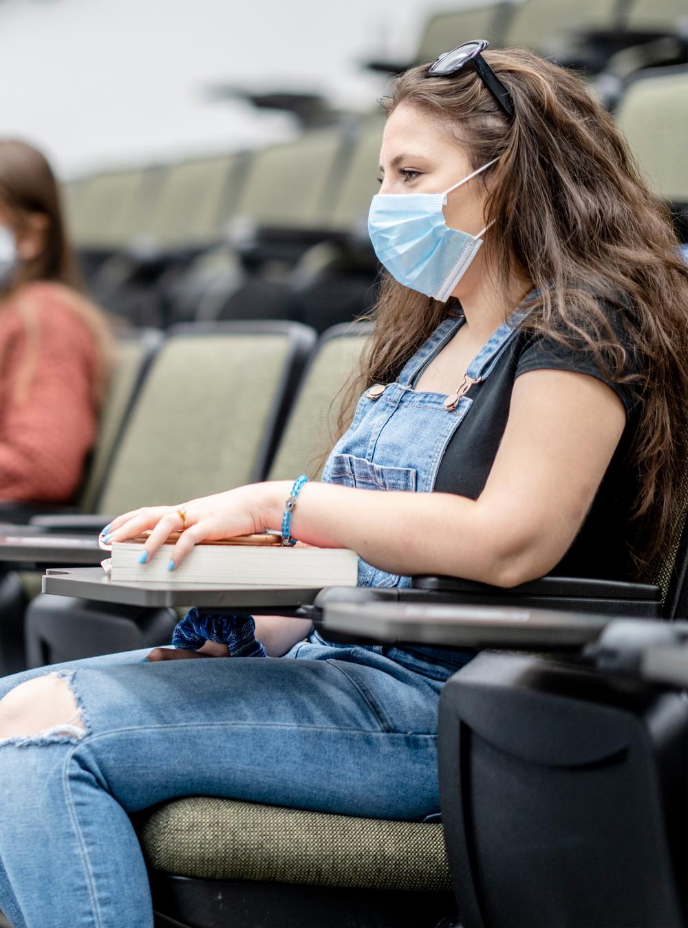 Students in masks in a university lecture hall