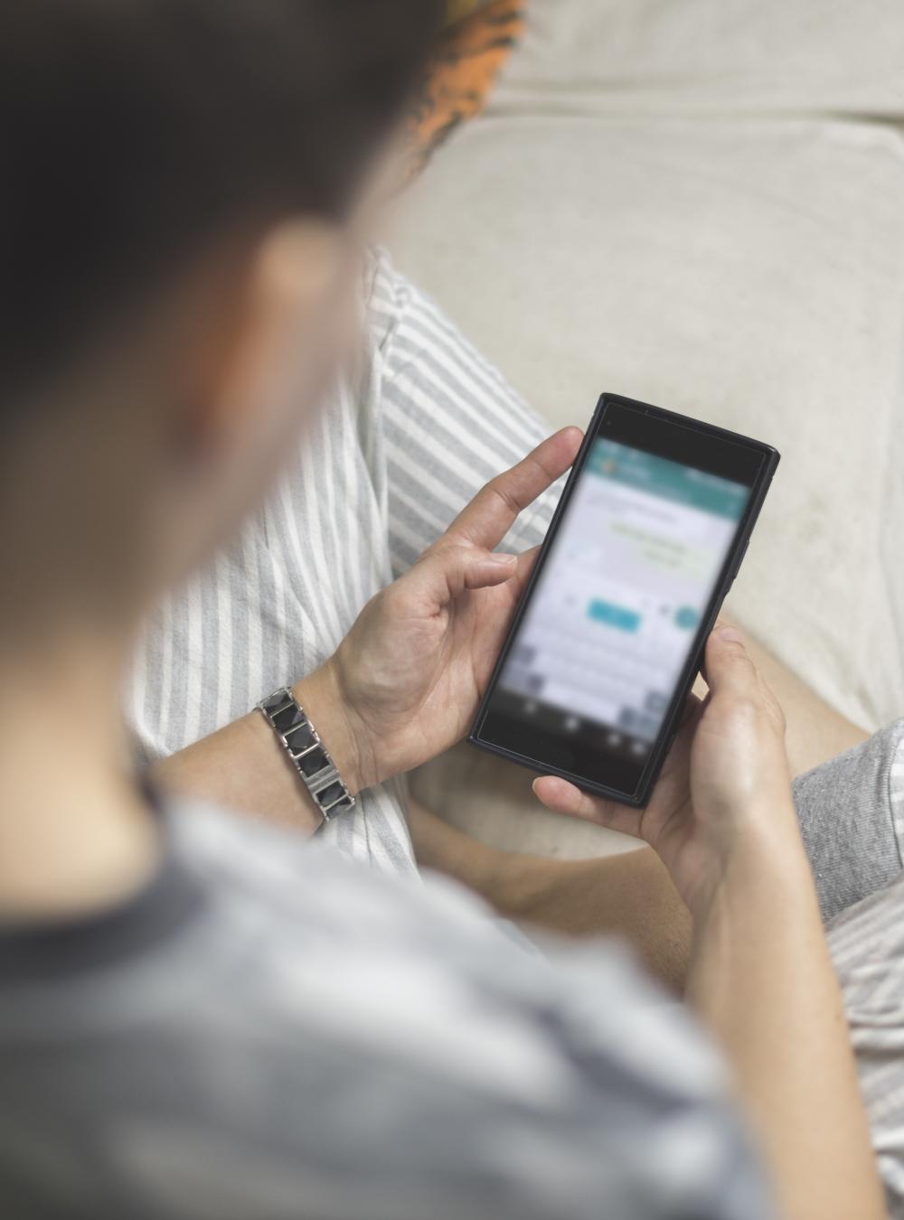 Woman browsing social media on her phone