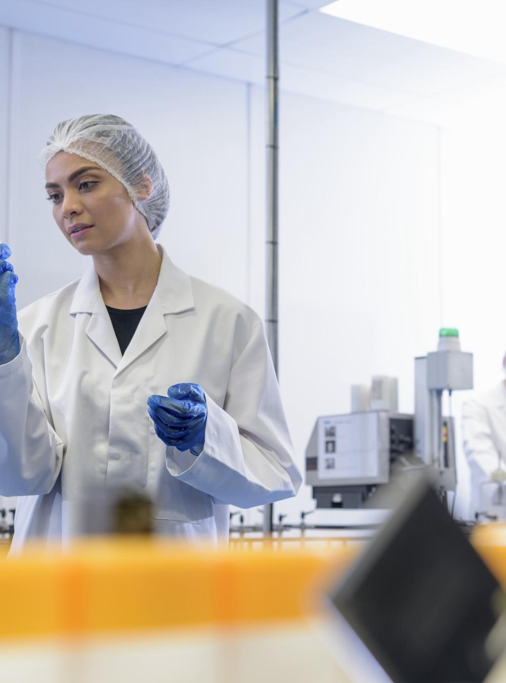 Woman working on a medication packaging assembly line