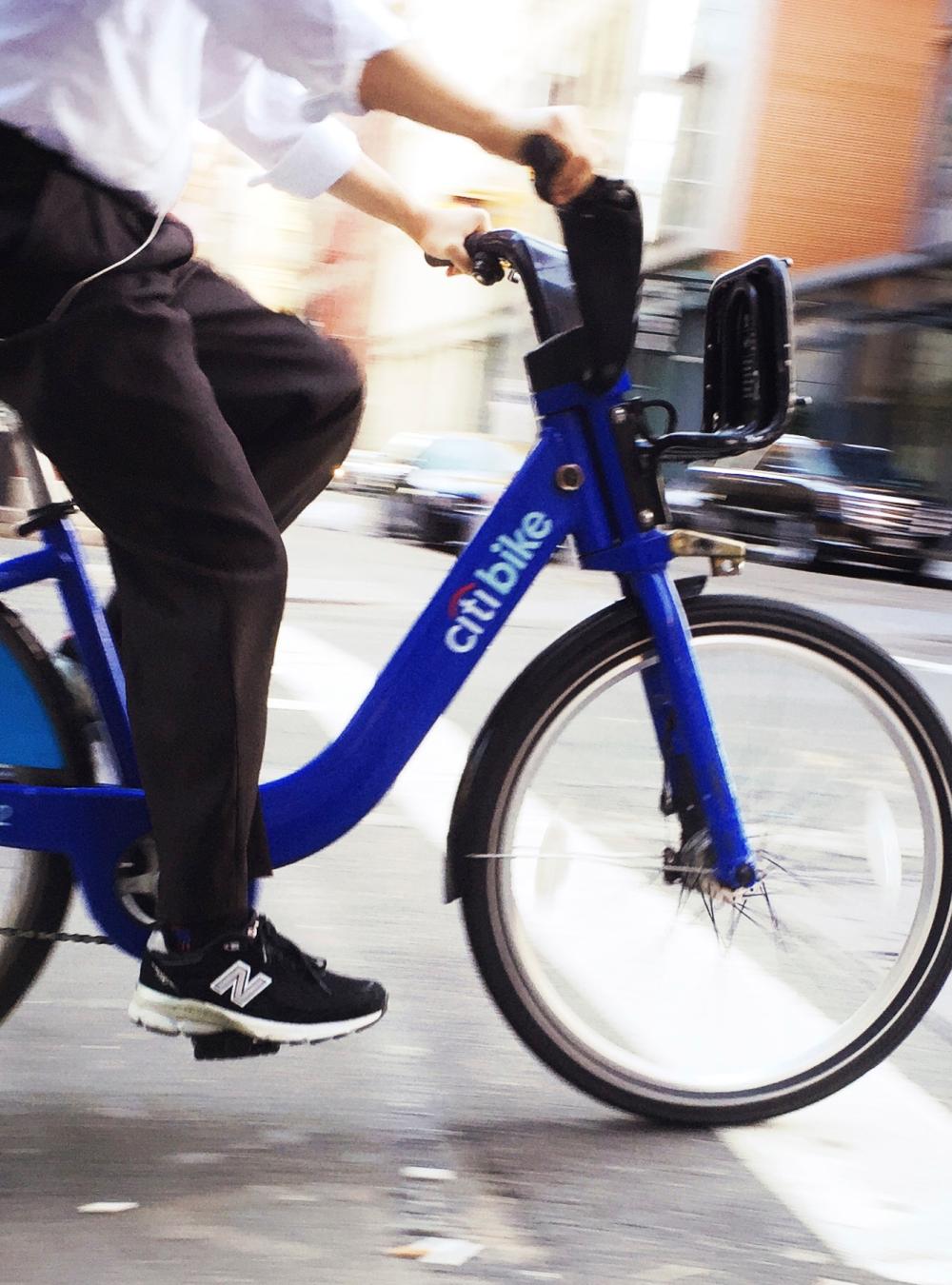 Citibike and Rider in Motion in Soho Manhattan