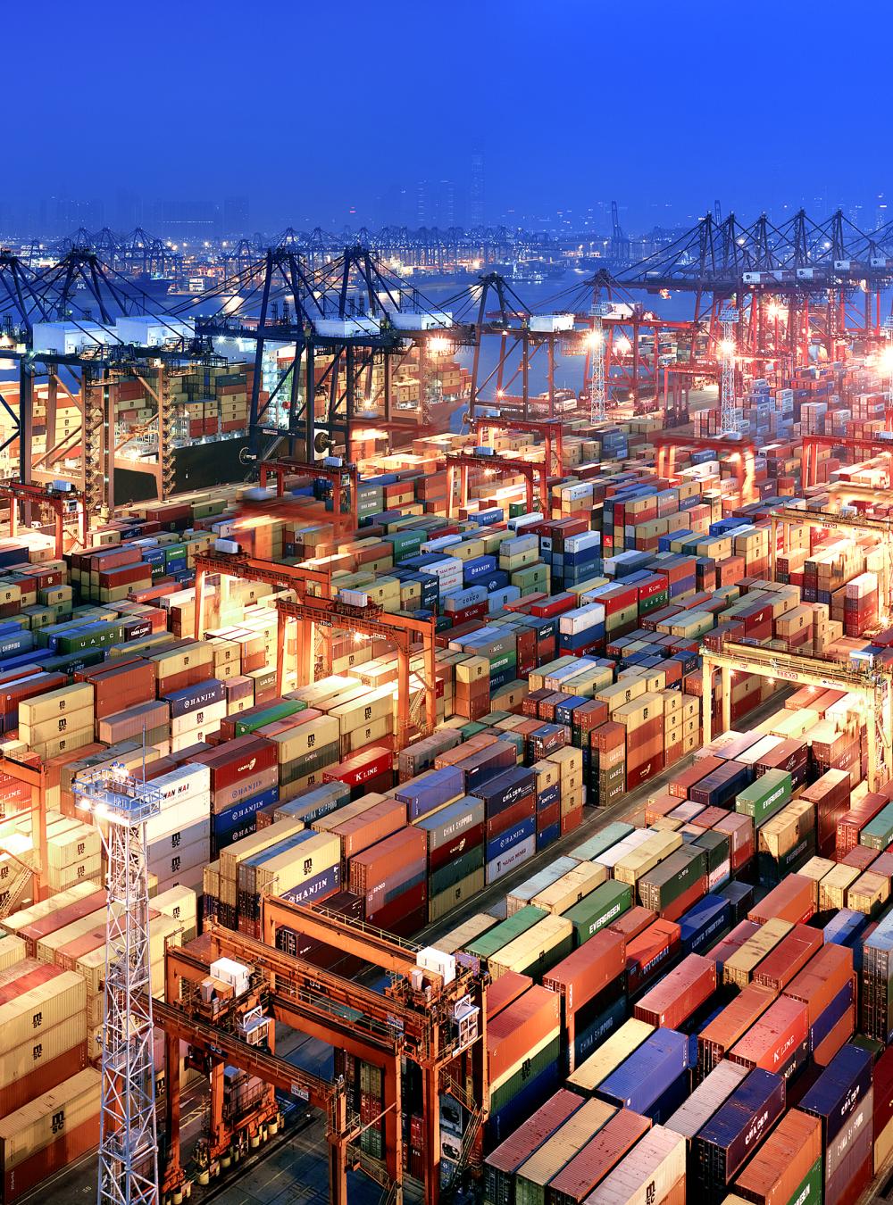 Container ships waiting in port.