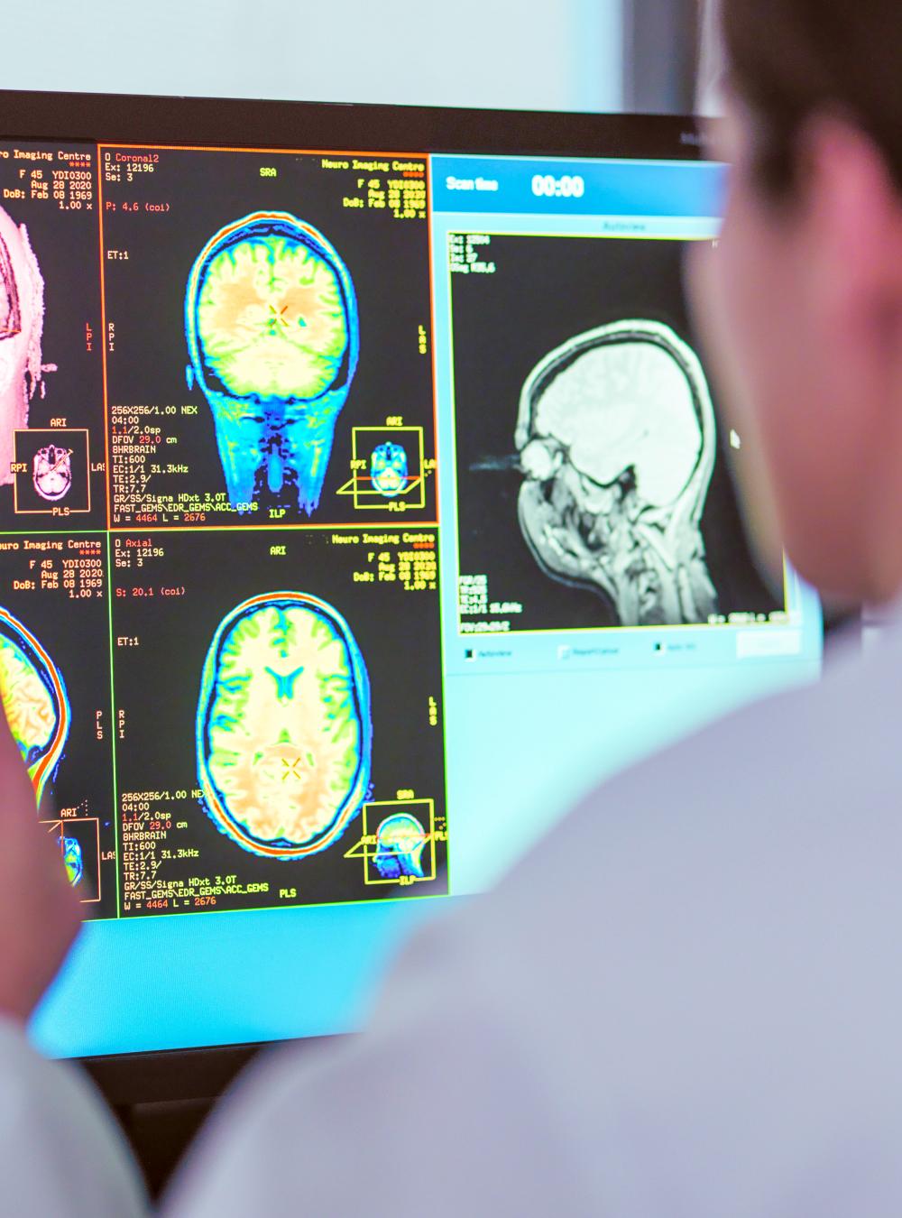 Doctor looking at MRI scanner monitor