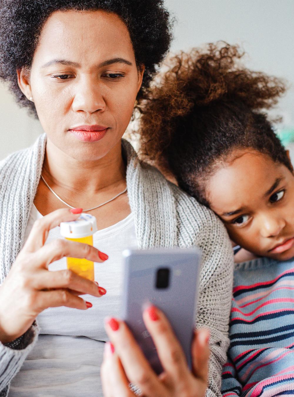 Mother communicates with the doctor on a video call