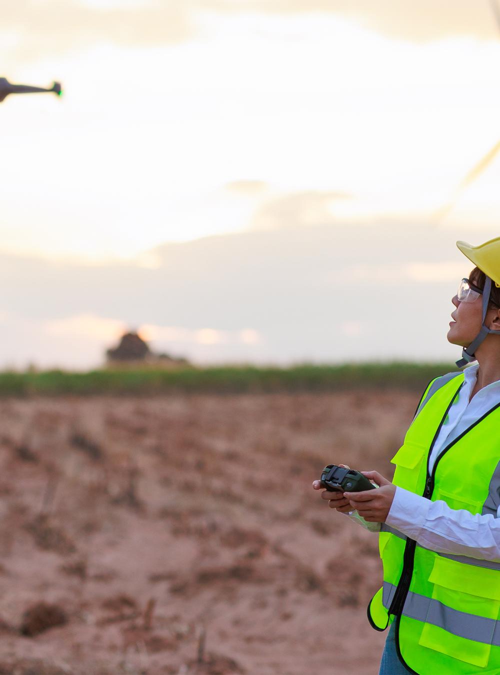 Person operating a drone in a wind farm