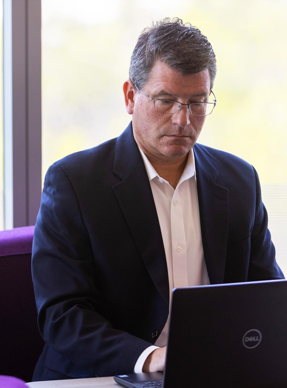 Tim Delaney at his computer.