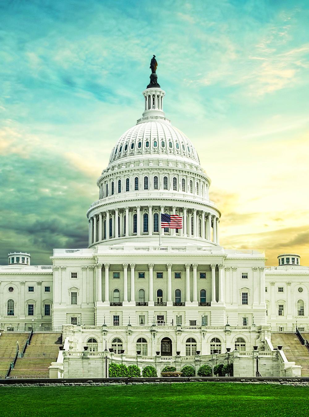 Capitol building framed by a dramatic sky