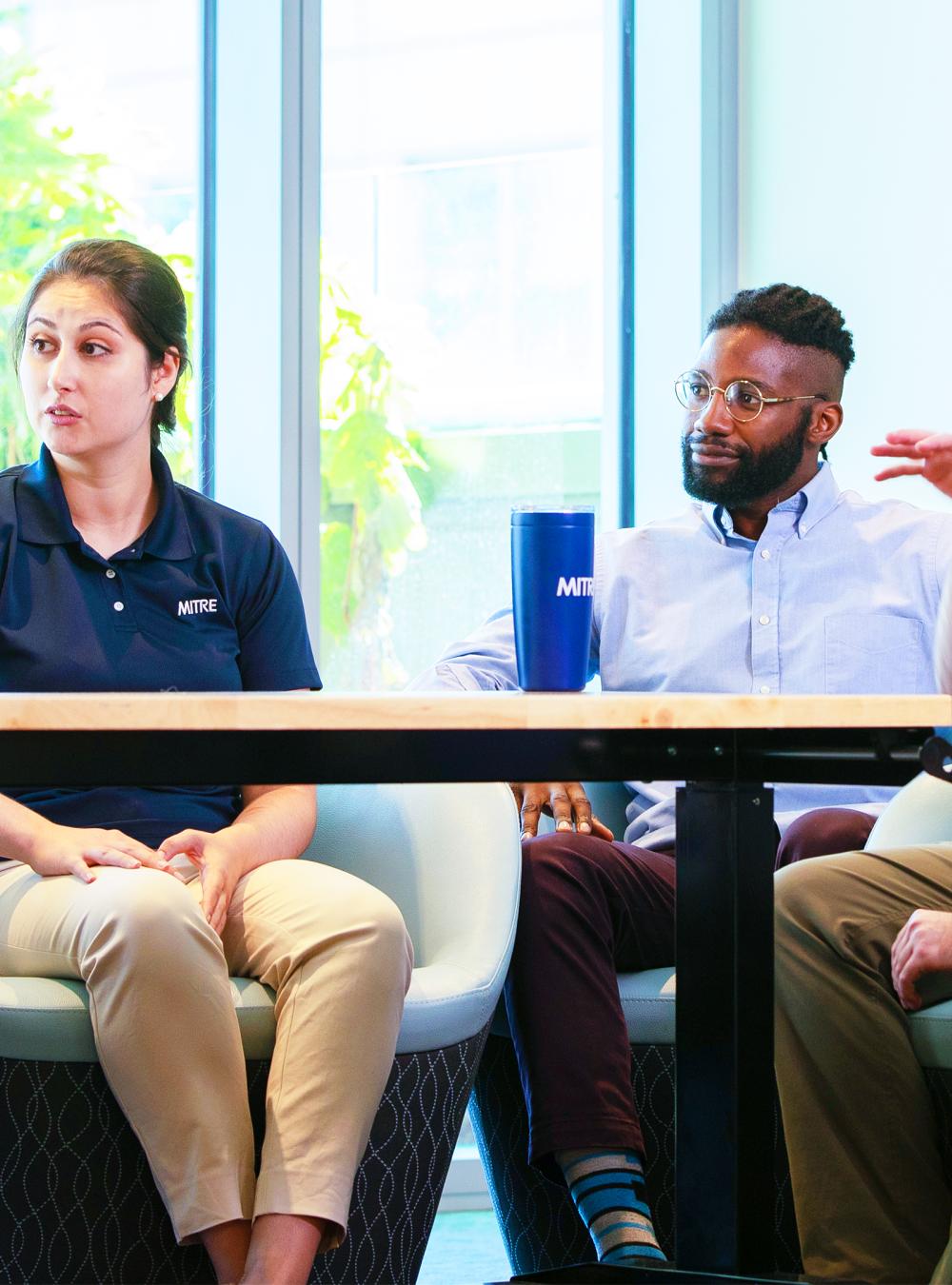 MITRE employees collaborate.