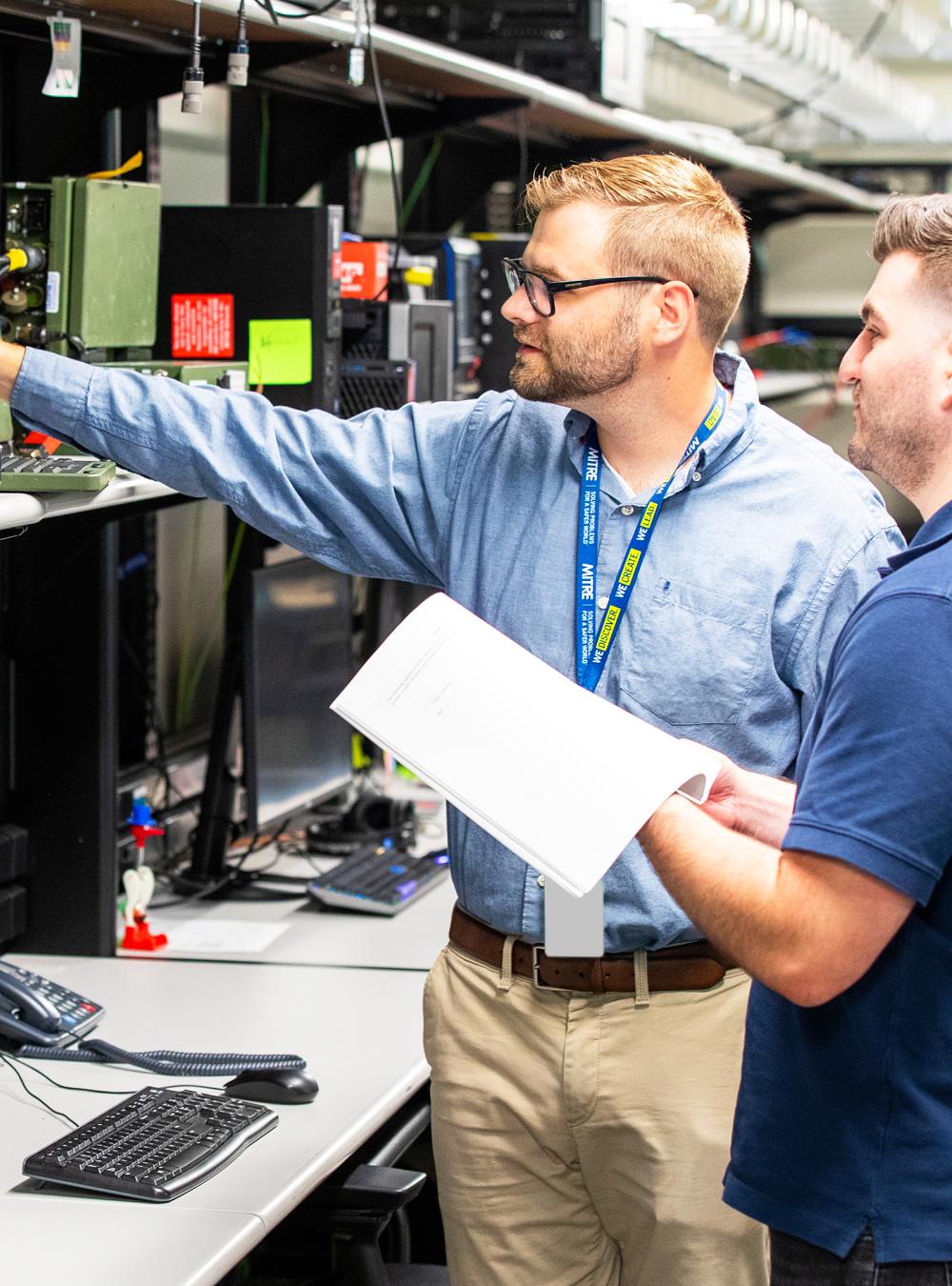 MITRE employees working in the E building lab
