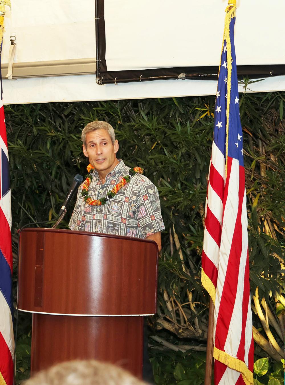 Keoki Jackson speaking at a podium