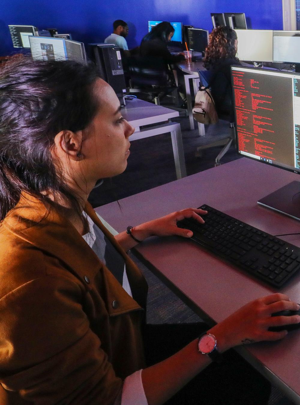 Young woman in a cybersecurity class