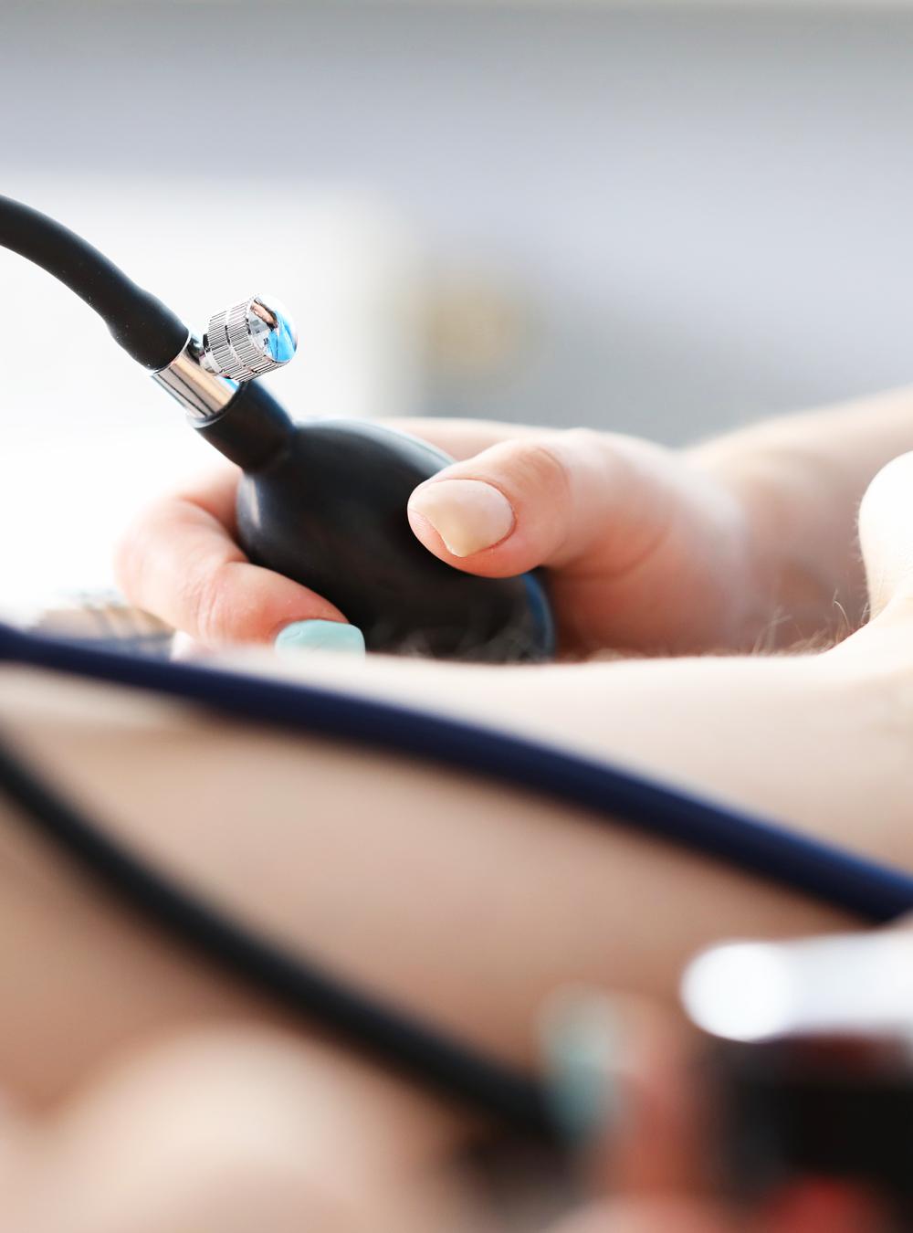 Nurse taking a patients blood pressure