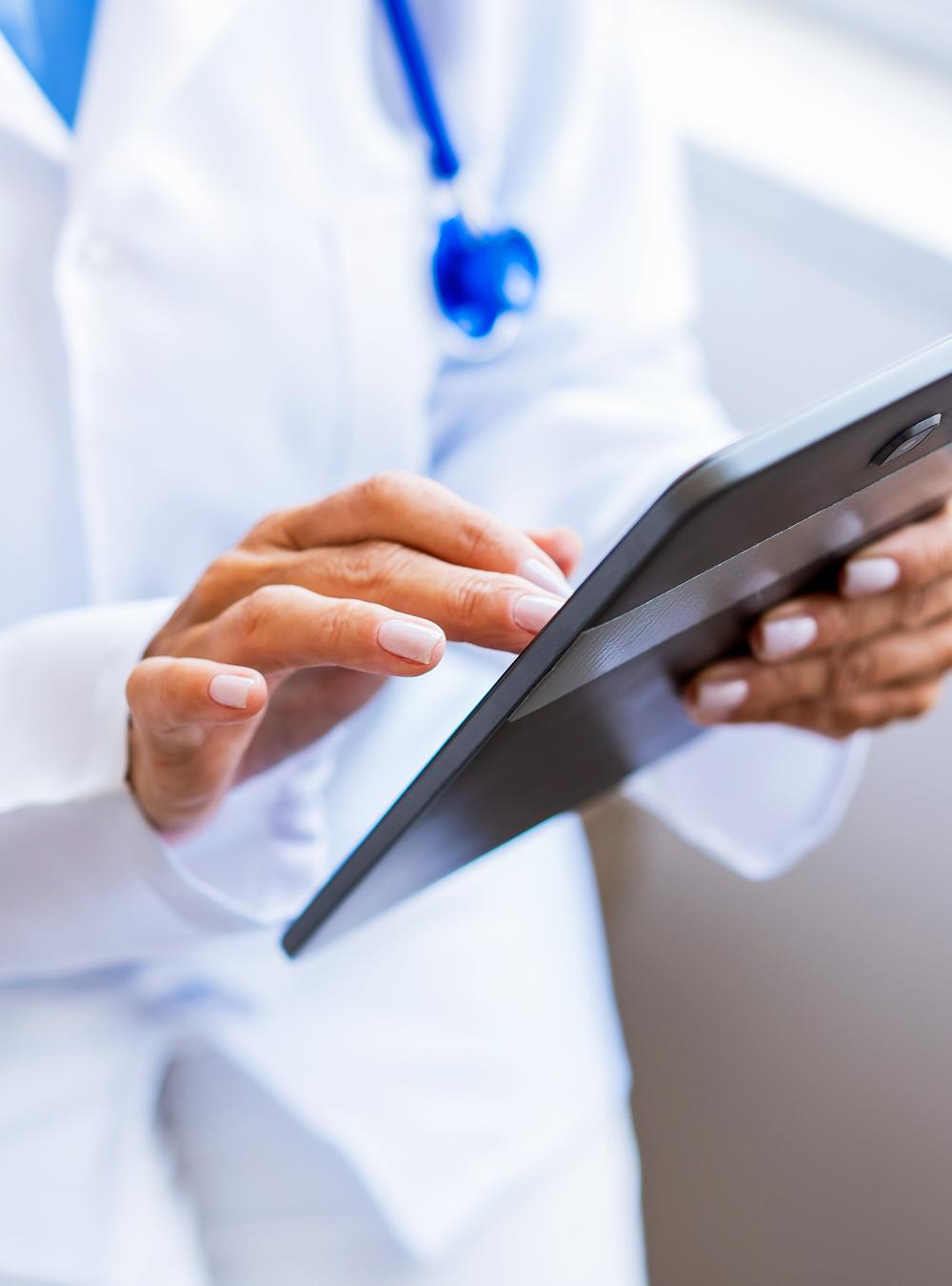 Female doctor using digital tablet