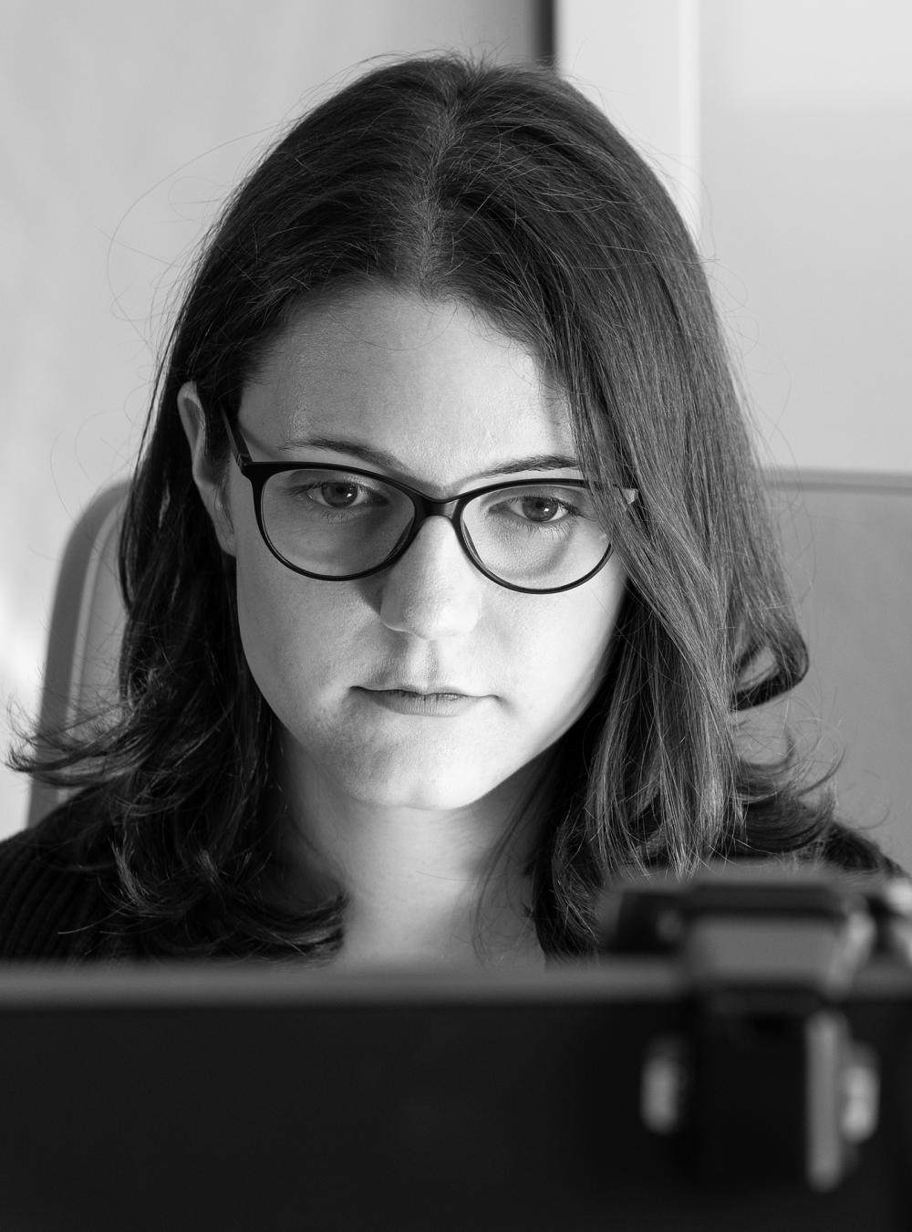 Elizabeth Karpinski working at her computer