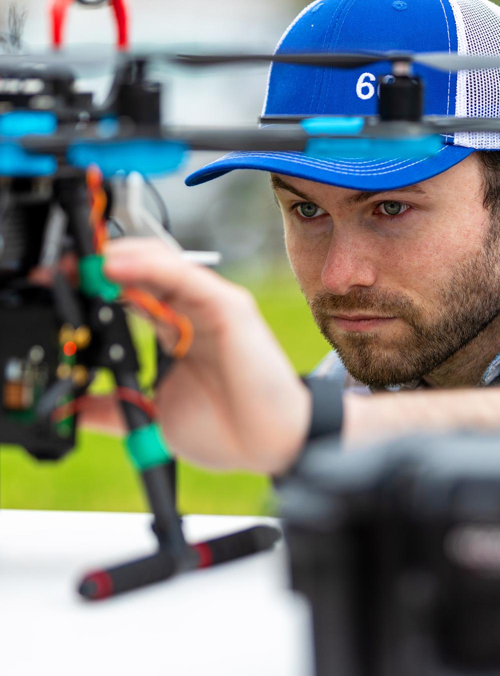 Employee holding a drone