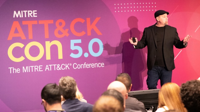 ATT&CKcon 5.0 speaker on stage