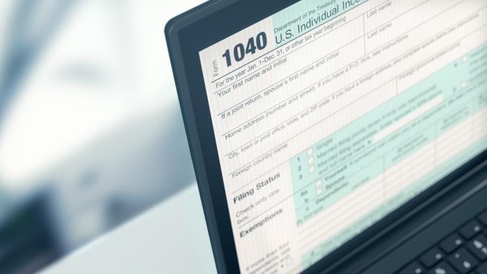 1040 tax form pulled up on a laptop