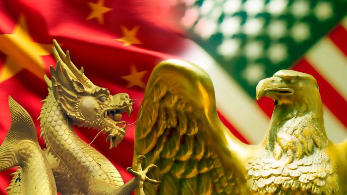 Flags and gold figures representing China and United States