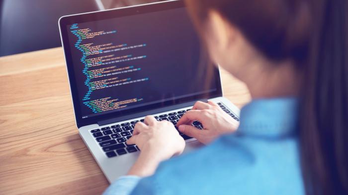 Woman hands coding html and programming on screen laptop