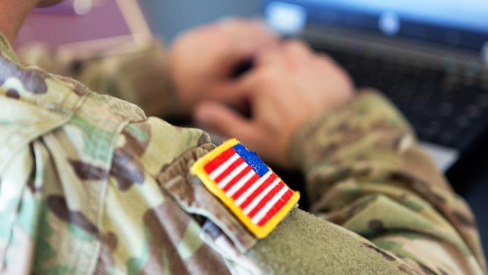 soldier working on laptop