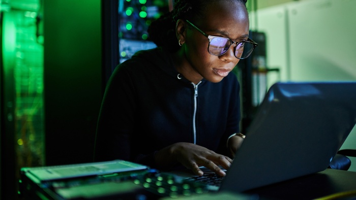 Woman typing on a laptop