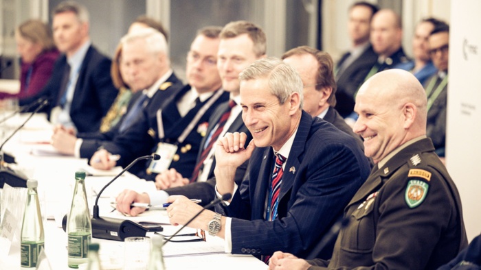 Keoki Jackson (second from right), MITRE National Security Sector SVP, represented MITRE at a Munich Security Conference
