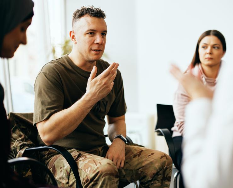 Soldier talks with counselor at military counseling center