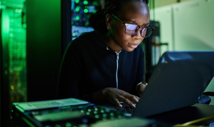 Woman typing on a laptop