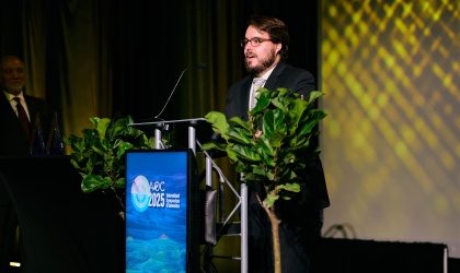 Brandt Lomen speaking at a podium