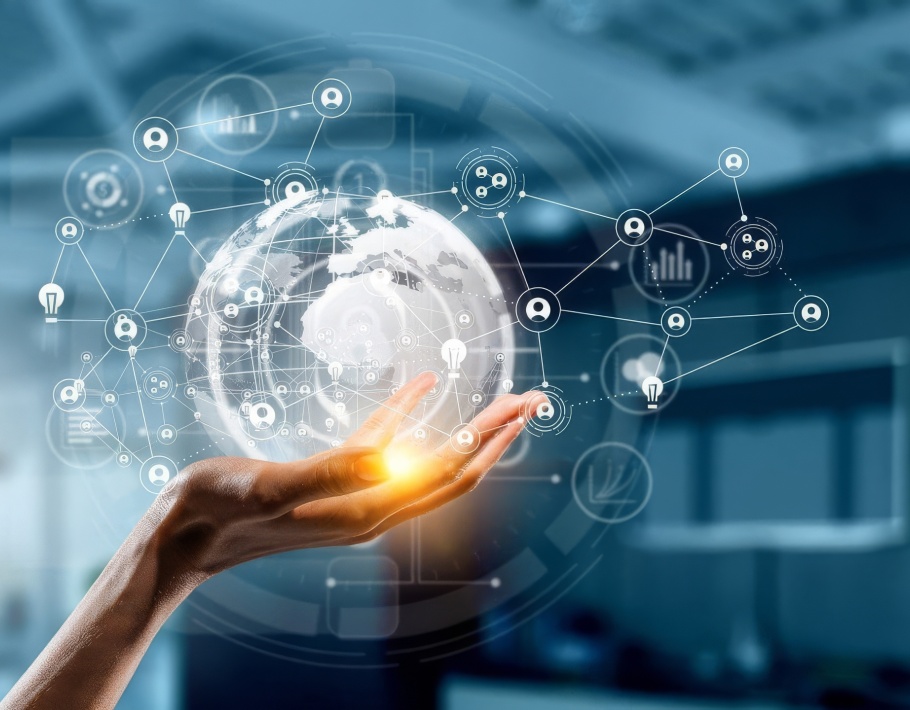 Composite image of a hand holding a digital globe