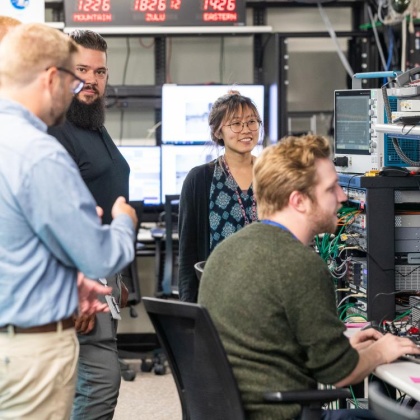 Group of employees working together in a lab